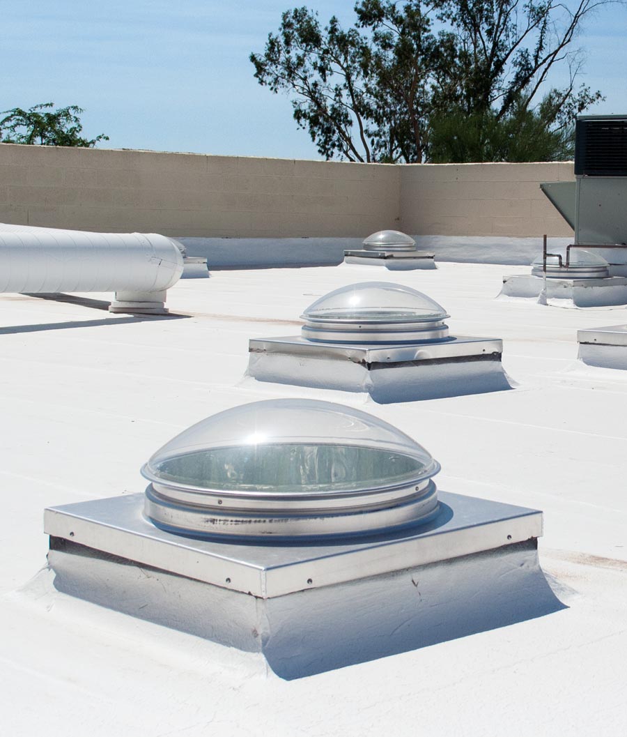 Several Natural Light commercial curb mount tubular skylights on foam roof