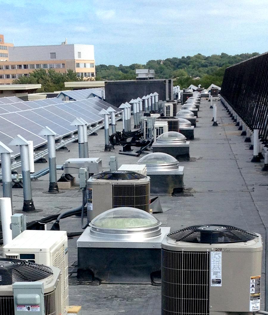 Several commercial curb mount tubular skylights on roof